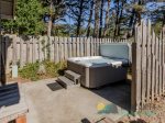 The hot tub has a privacy fence tucked in the backyard, where you can still hear the soaring ocean.